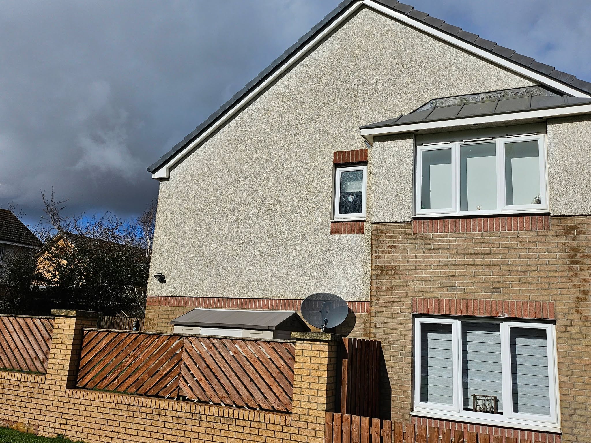 Render softwashing on gable wall — after