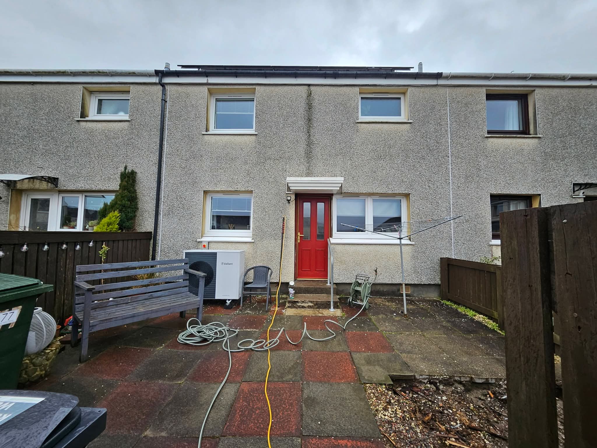 Render softwashing on rear elevation — before